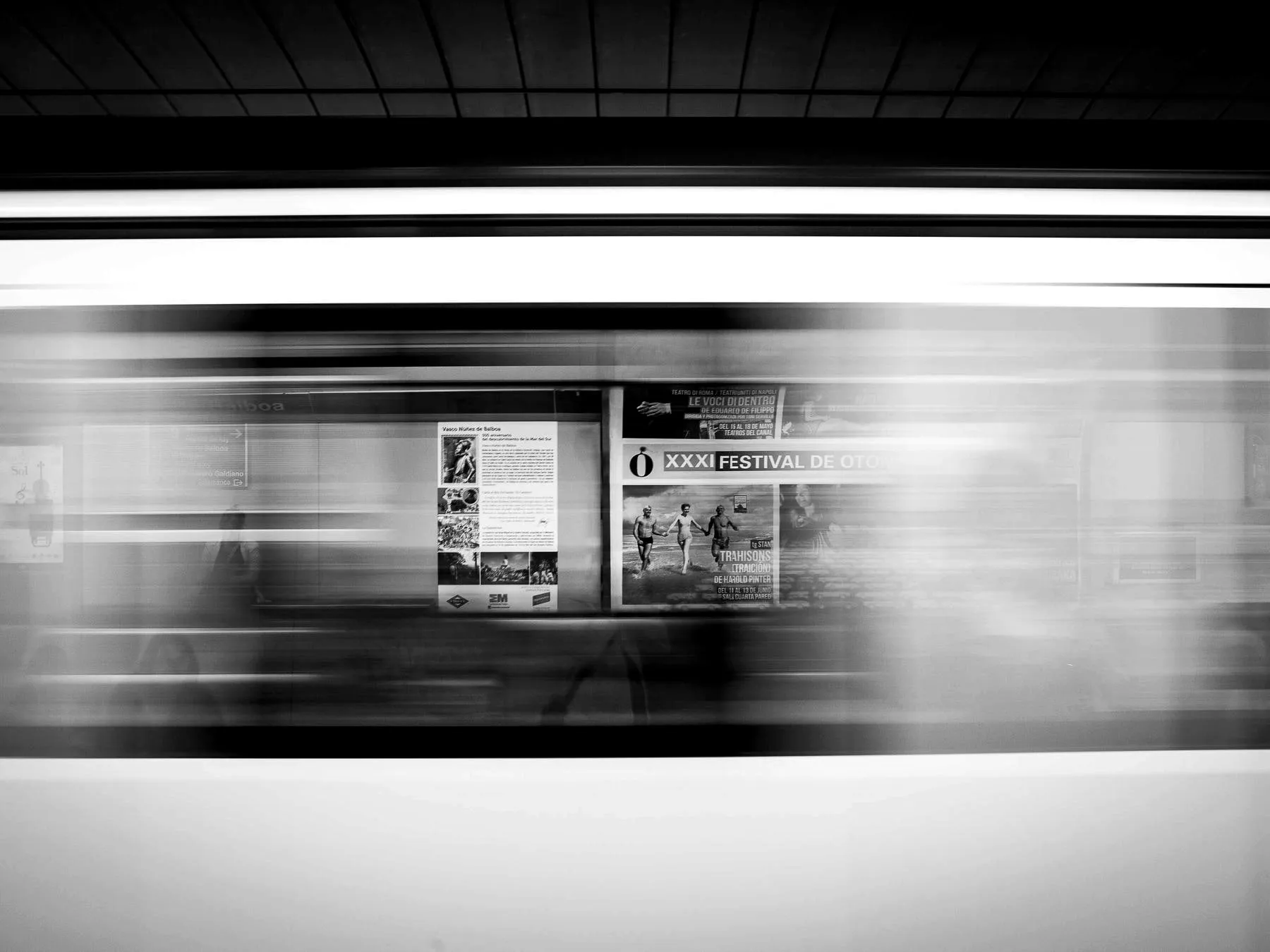 A train blurred into streaks of light as it passes