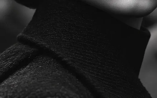 Detail of a black wool coat collar